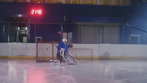 Professional-hockey-player-attacks-the-gate-and-strikes,-but-the-goalkeeper-beats-the-puck.-A-goal-in-hockey.-Goal-scored.-Bullet-penetration